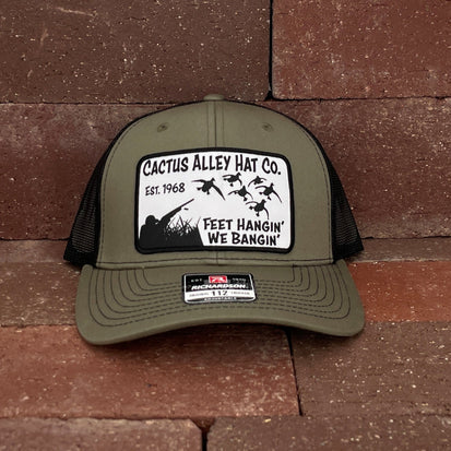 Cactus Alley Hat Co "Feet Hangin" Trucker Cap in Green & Black